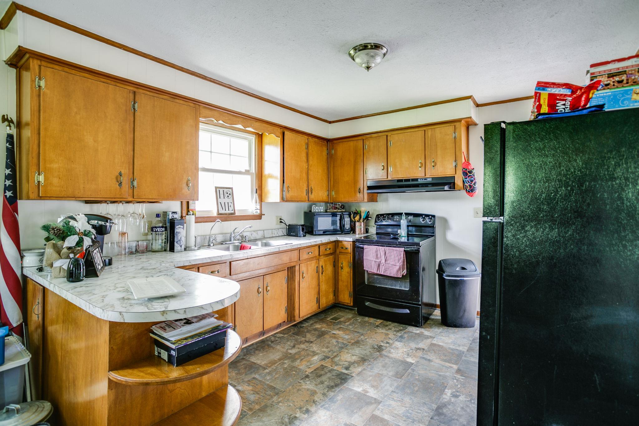 2818 Ewell Elliott Road Springfield, TN 37172 - Photo 10 of 24 a kitchen with a refrigerator and a stove