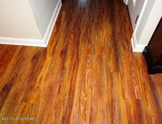 9317 Gutenberg Road Jeffersontown, KY 40291 - Photo 15 of 30 Easy care laminate flooring looks like scrapped wood.