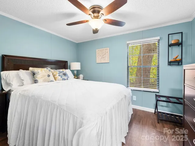 a bedroom with a bed and a tv