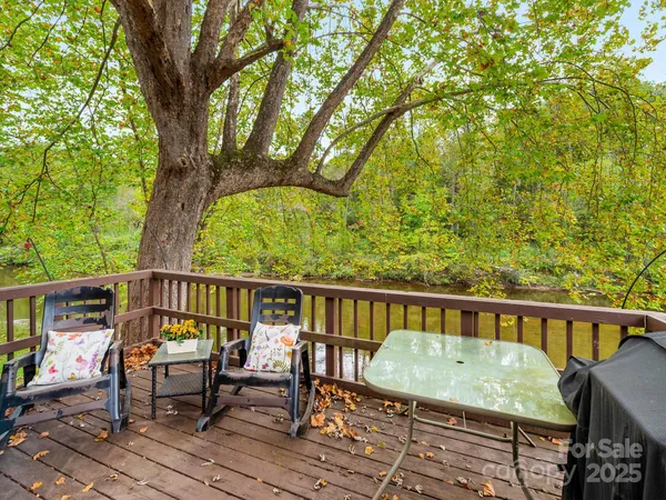a view of a balcony with chairs