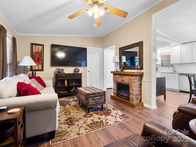 a living room with fireplace furniture and a fireplace
