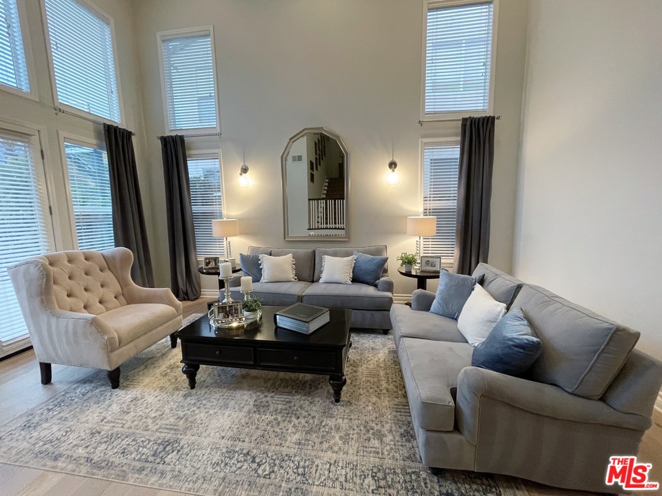 26810 Kendall Lane Stevenson Ranch, CA 91381 - Photo 13 of 44 a living room with furniture and a potted plant