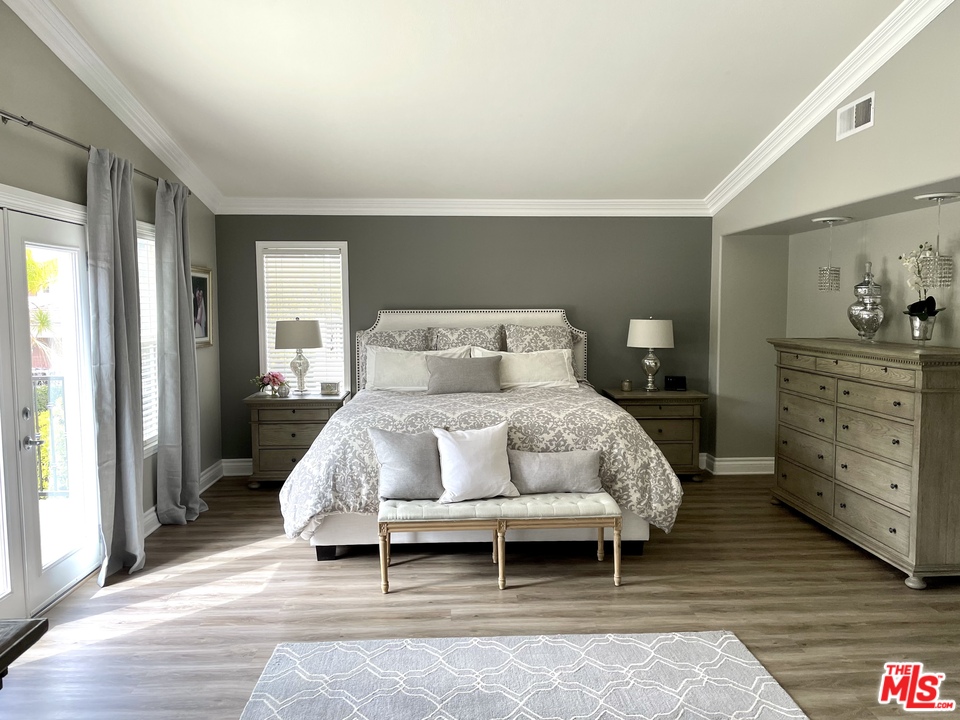 26810 Kendall Lane Stevenson Ranch, CA 91381 - Photo 25 of 44 a bed sitting in a bedroom next to a window and dresser