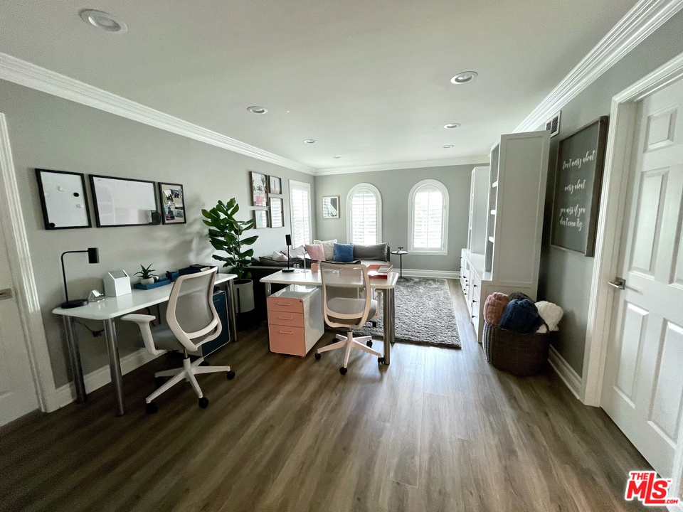 26810 Kendall Lane Stevenson Ranch, CA 91381 - Photo 33 of 44 a living room with furniture a wooden floor and a sink