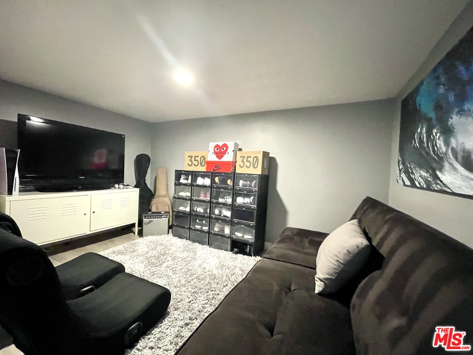 26810 Kendall Lane Stevenson Ranch, CA 91381 - Photo 39 of 44 a living room with furniture and a flat screen tv