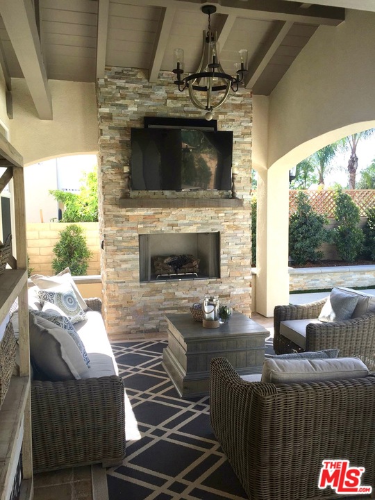 26810 Kendall Lane Stevenson Ranch, CA 91381 - Photo 5 of 44 a living room with furniture and a fireplace