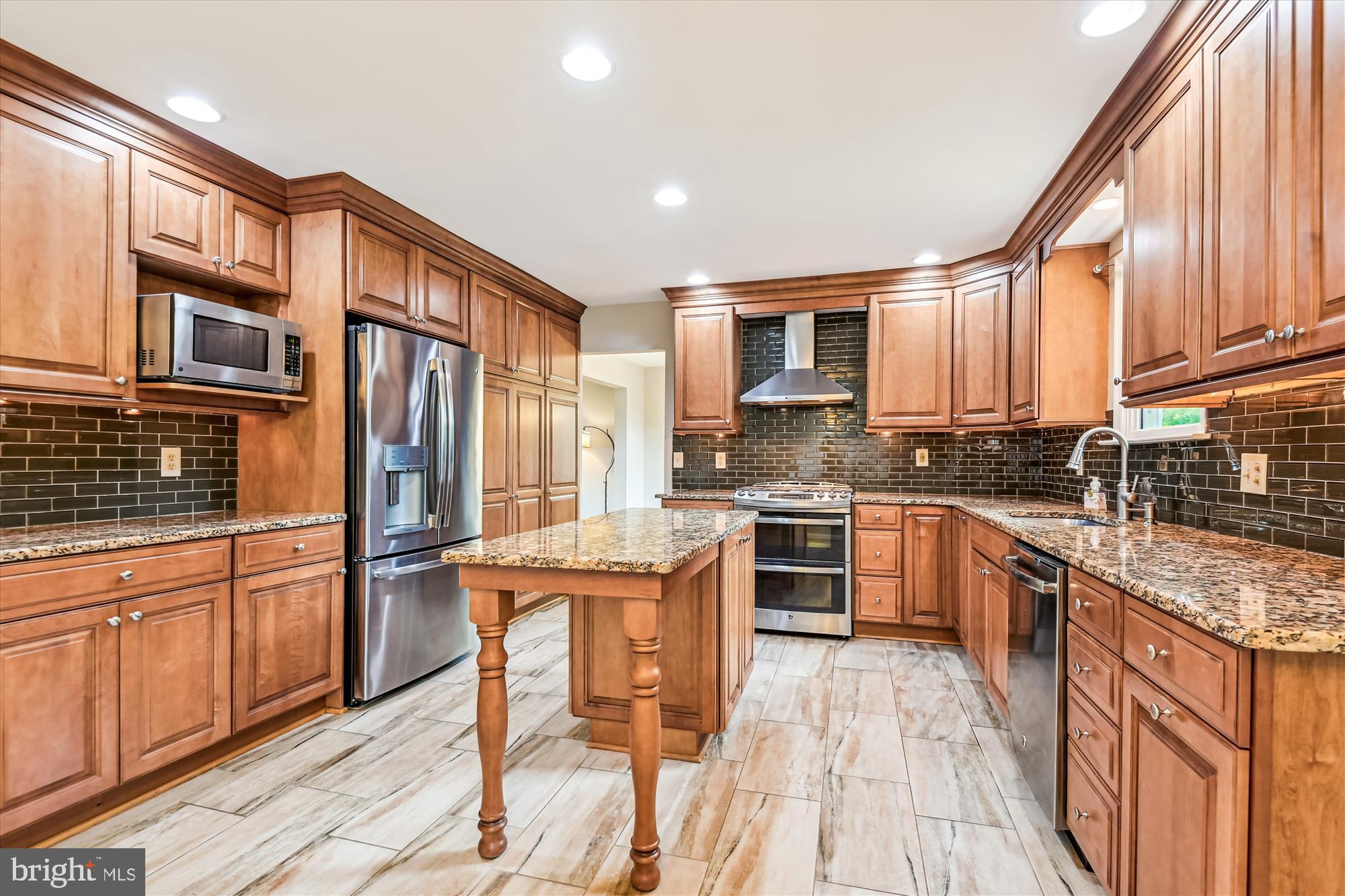 1302 Terry Way Fallston, MD 21047 - Photo 13 of 51 a kitchen with stainless steel appliances granite countertop a refrigerator a stove top oven and white cabinets