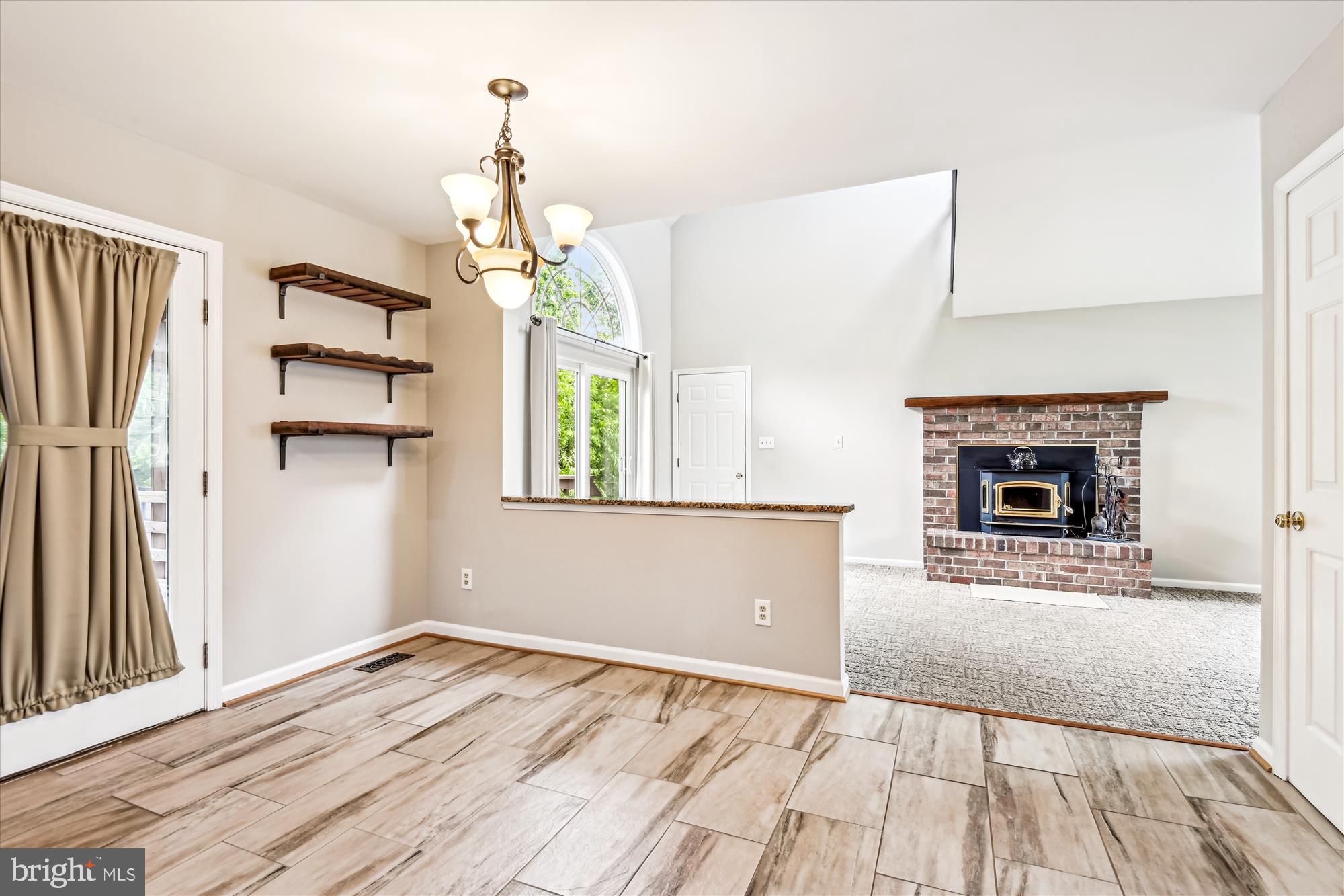 1302 Terry Way Fallston, MD 21047 - Photo 18 of 51 wooden floor fireplace and windows in an empty room