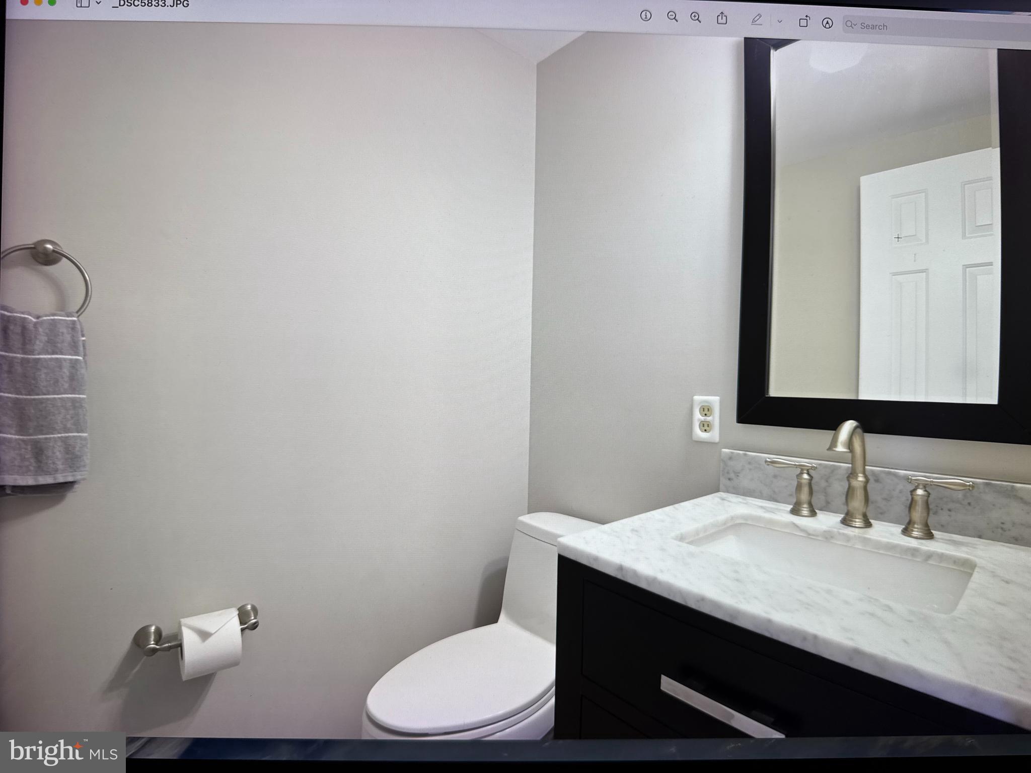 1302 Terry Way Fallston, MD 21047 - Photo 28 of 51 a bathroom with a granite countertop toilet sink and mirror