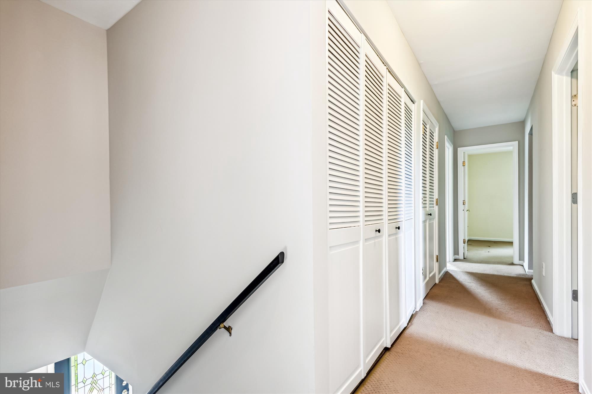 1302 Terry Way Fallston, MD 21047 - Photo 29 of 51 a view of a hallway with a white walls and stairs