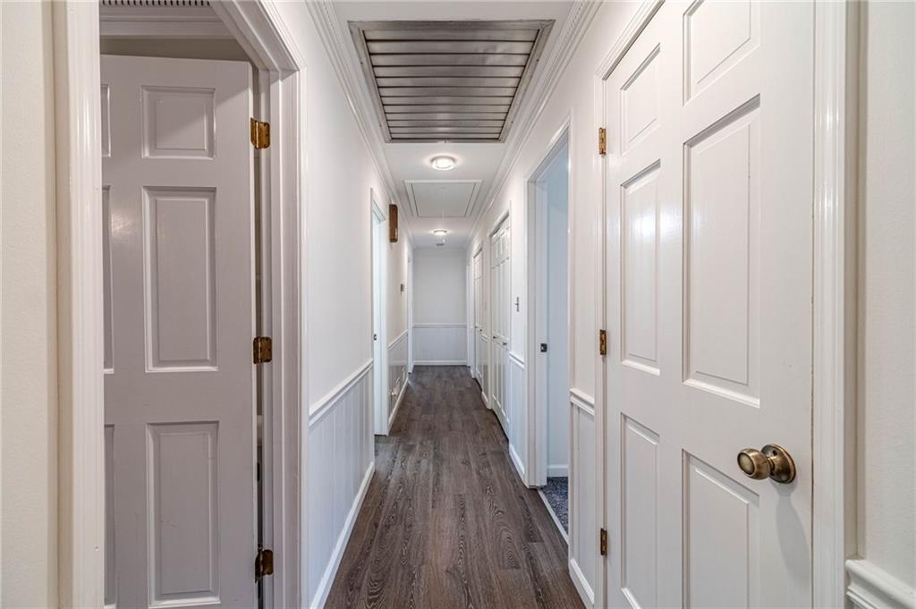 492 New Hope Road Lawrenceville, GA 30046 - Photo 20 of 48 a view of a hallway with wooden floor and staircase