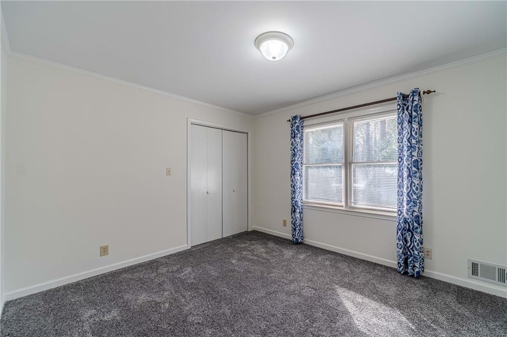 492 New Hope Road Lawrenceville, GA 30046 - Photo 21 of 48 an empty room with windows
