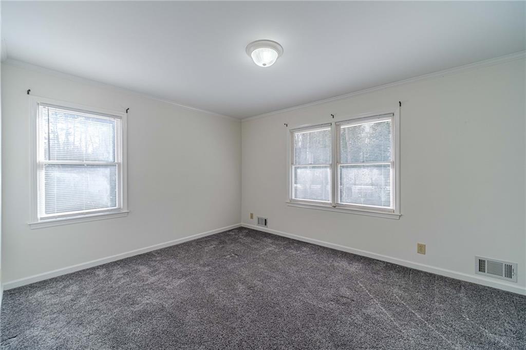 492 New Hope Road Lawrenceville, GA 30046 - Photo 23 of 48 an empty room with windows