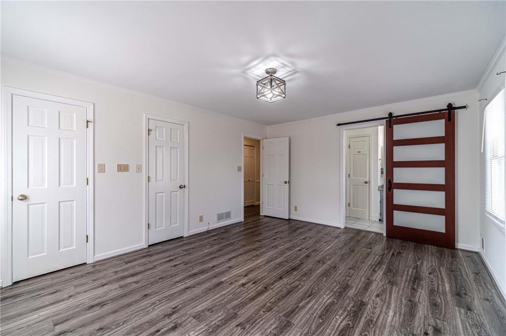 492 New Hope Road Lawrenceville, GA 30046 - Photo 26 of 48 a view of empty room with wooden floor and fan