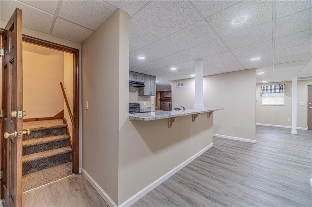 492 New Hope Road Lawrenceville, GA 30046 - Photo 30 of 48 a view of kitchen with cabinets and wooden floor