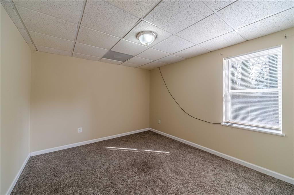 492 New Hope Road Lawrenceville, GA 30046 - Photo 36 of 48 an empty room with windows
