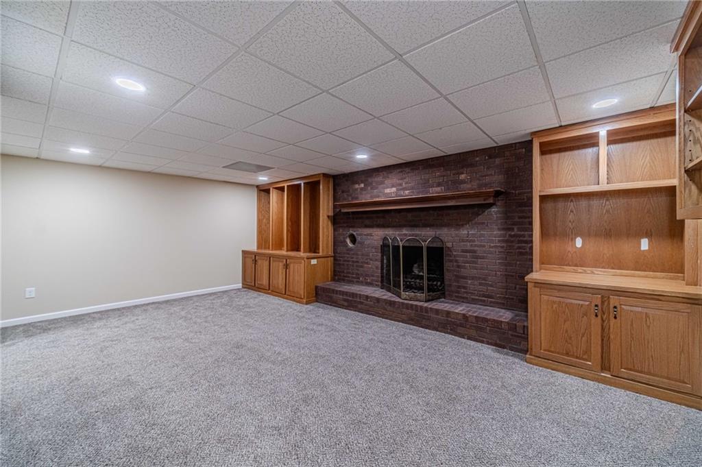 492 New Hope Road Lawrenceville, GA 30046 - Photo 37 of 48 an empty room with fireplace and a window