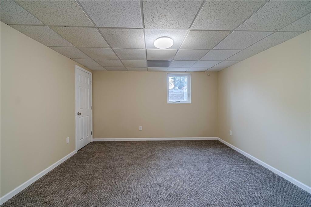 492 New Hope Road Lawrenceville, GA 30046 - Photo 41 of 48 a view of empty room with windows