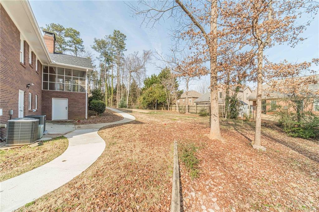 492 New Hope Road Lawrenceville, GA 30046 - Photo 43 of 48 a view of a yard with a house