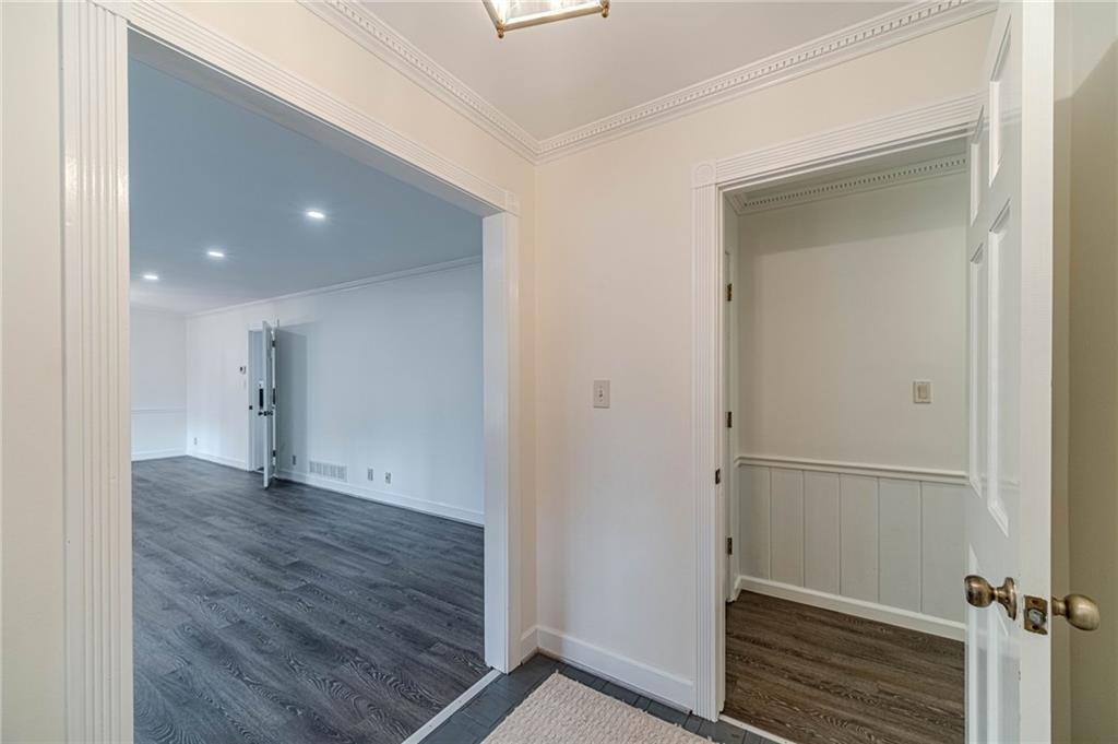 492 New Hope Road Lawrenceville, GA 30046 - Photo 5 of 48 an empty room with wooden floor and closet