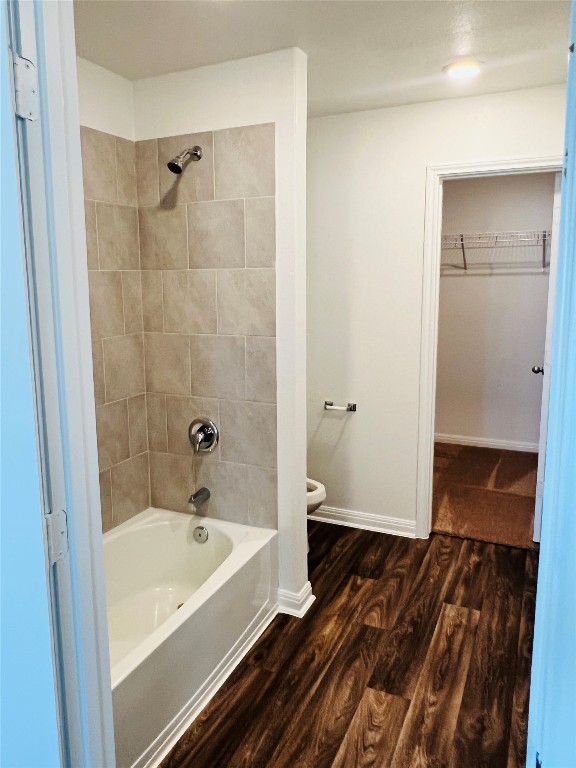 117 Maywood Lane Jarrell, TX 76537 - Photo 4 of 5 Bathroom with wood finished floors, shower / washtub combination, and a spacious closet