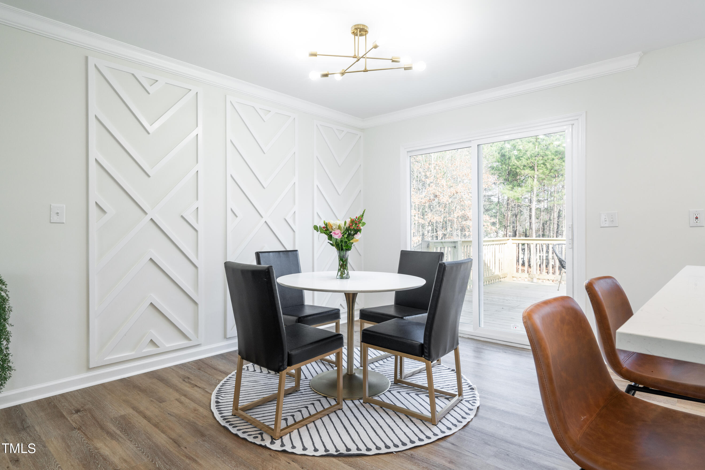 5017 Robinwood Road Durham, NC 27713 - Photo 13 of 45 a view of a dining room with furniture window and wooden floor