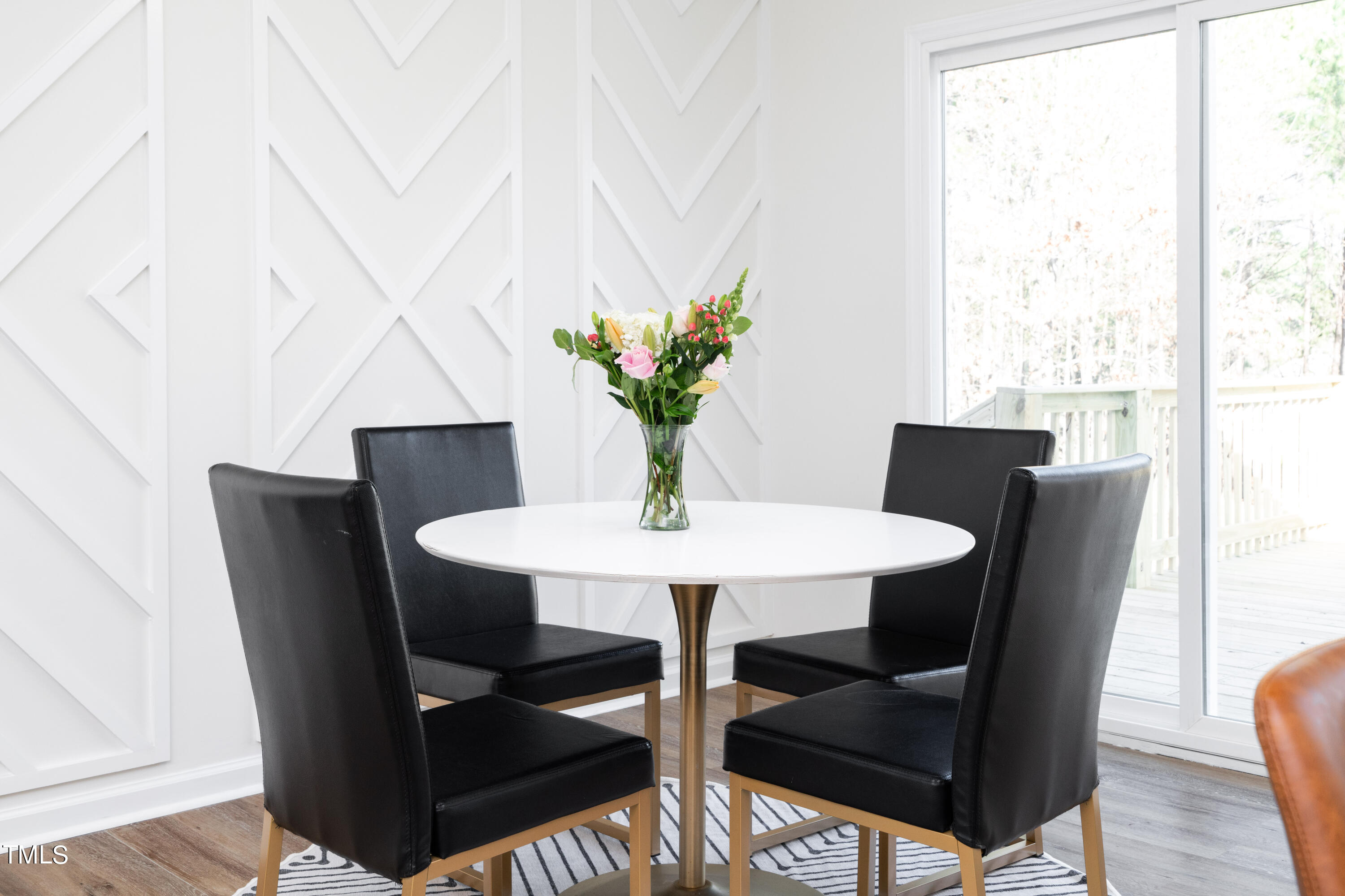 5017 Robinwood Road Durham, NC 27713 - Photo 14 of 45 a view of a dining room with furniture window and wooden floor