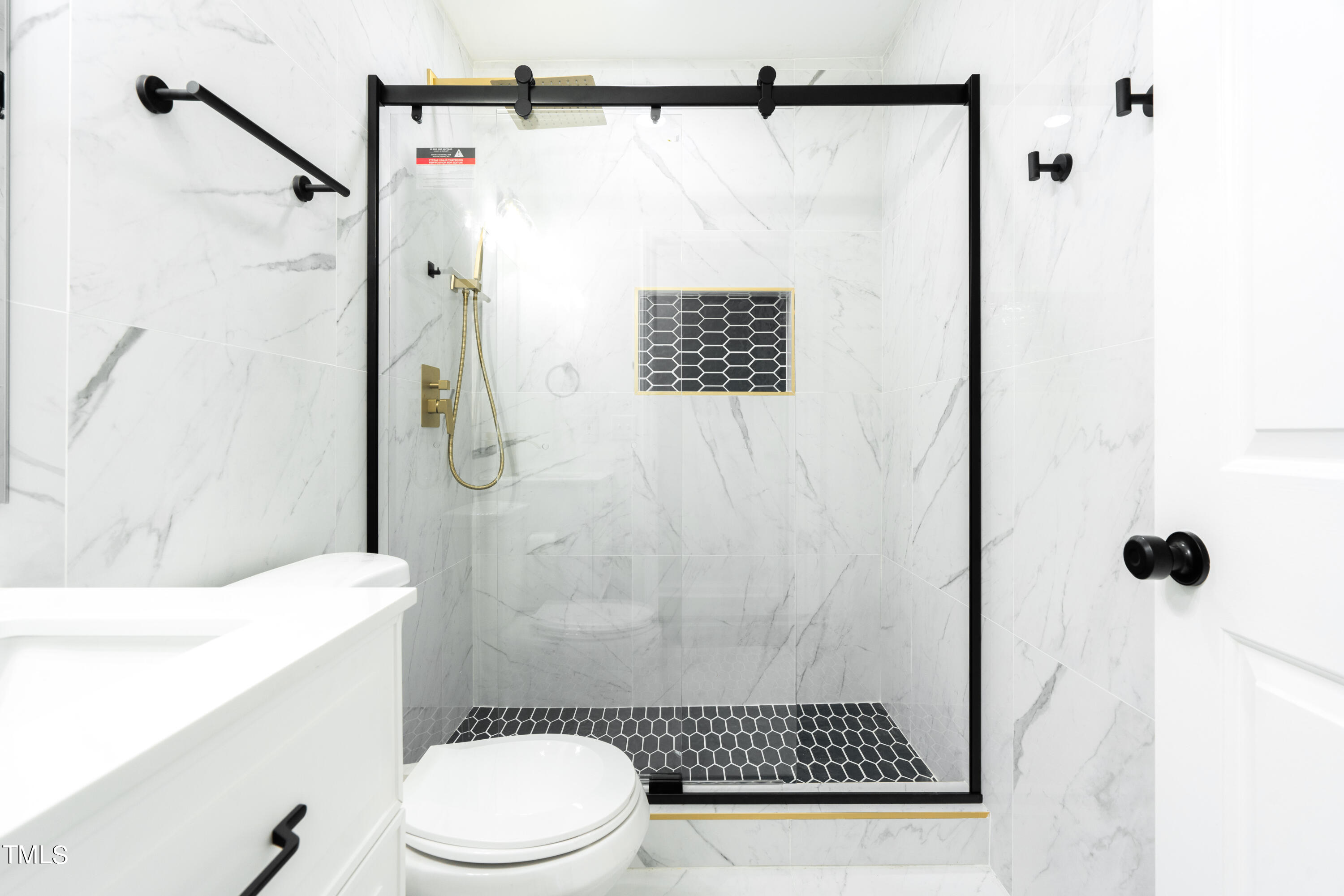 5017 Robinwood Road Durham, NC 27713 - Photo 18 of 45 a bathroom with a shower toilet and sink