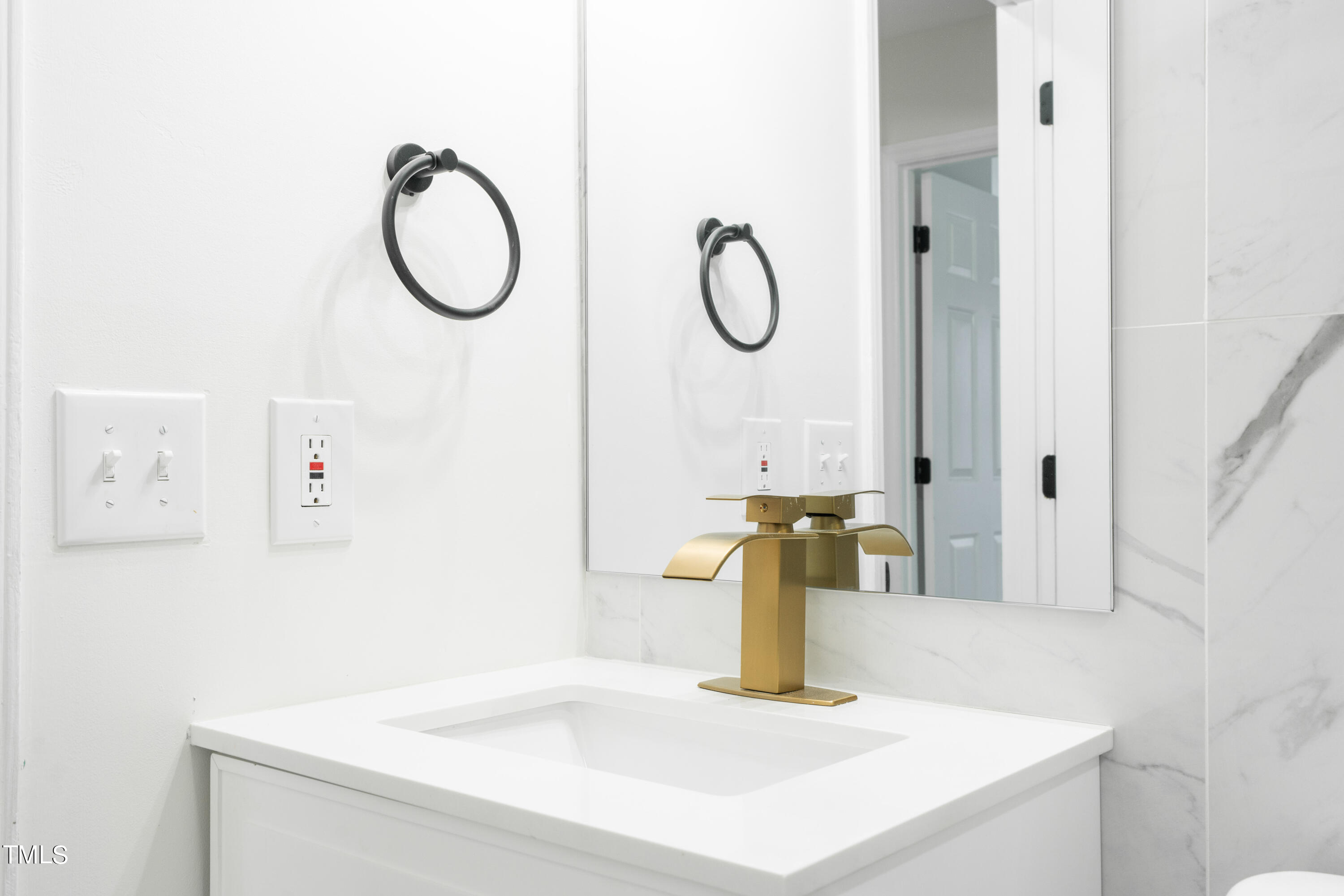 5017 Robinwood Road Durham, NC 27713 - Photo 19 of 45 a bathroom with a sink and a mirror