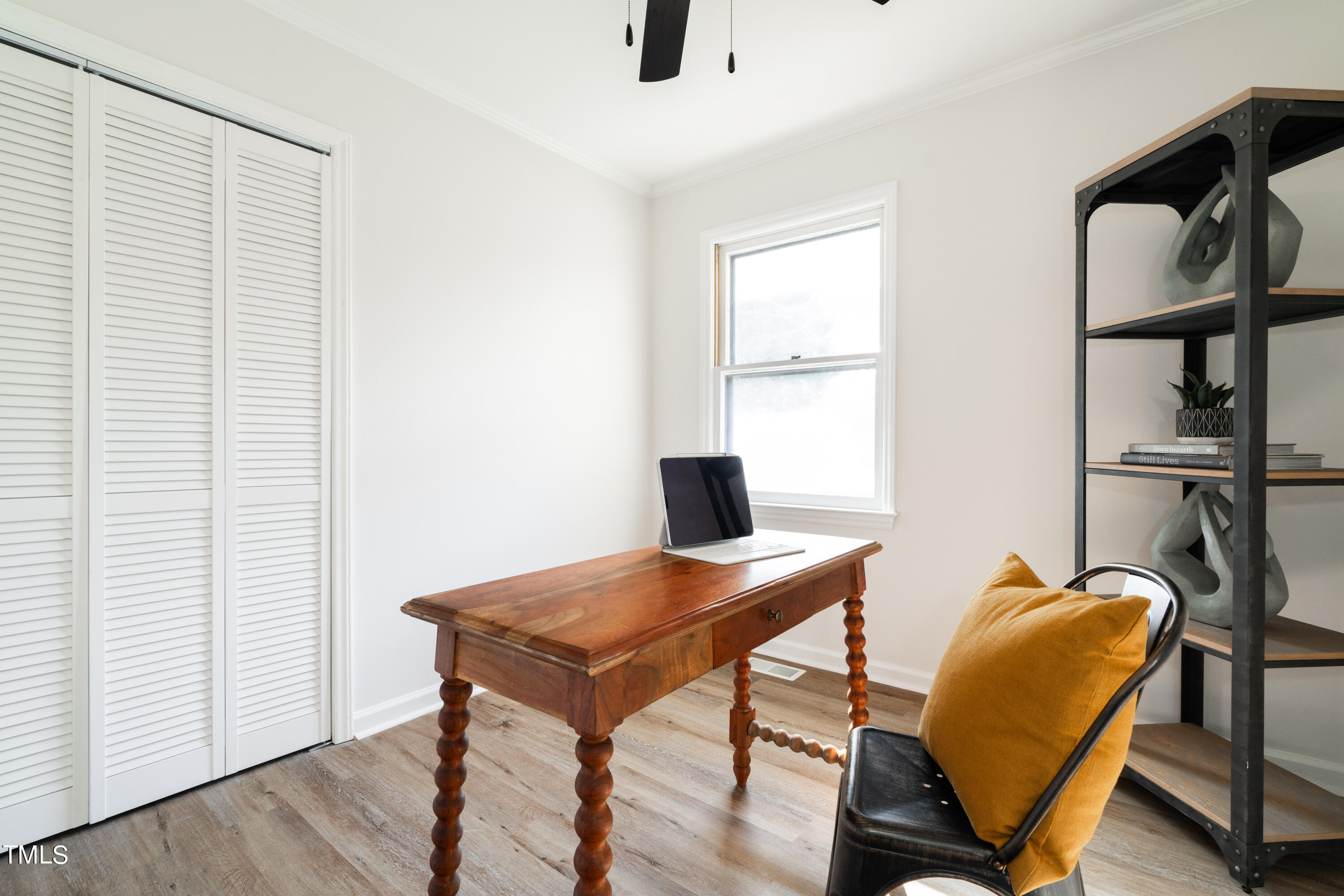 5017 Robinwood Road Durham, NC 27713 - Photo 20 of 45 a view of a workspace with furniture and a window