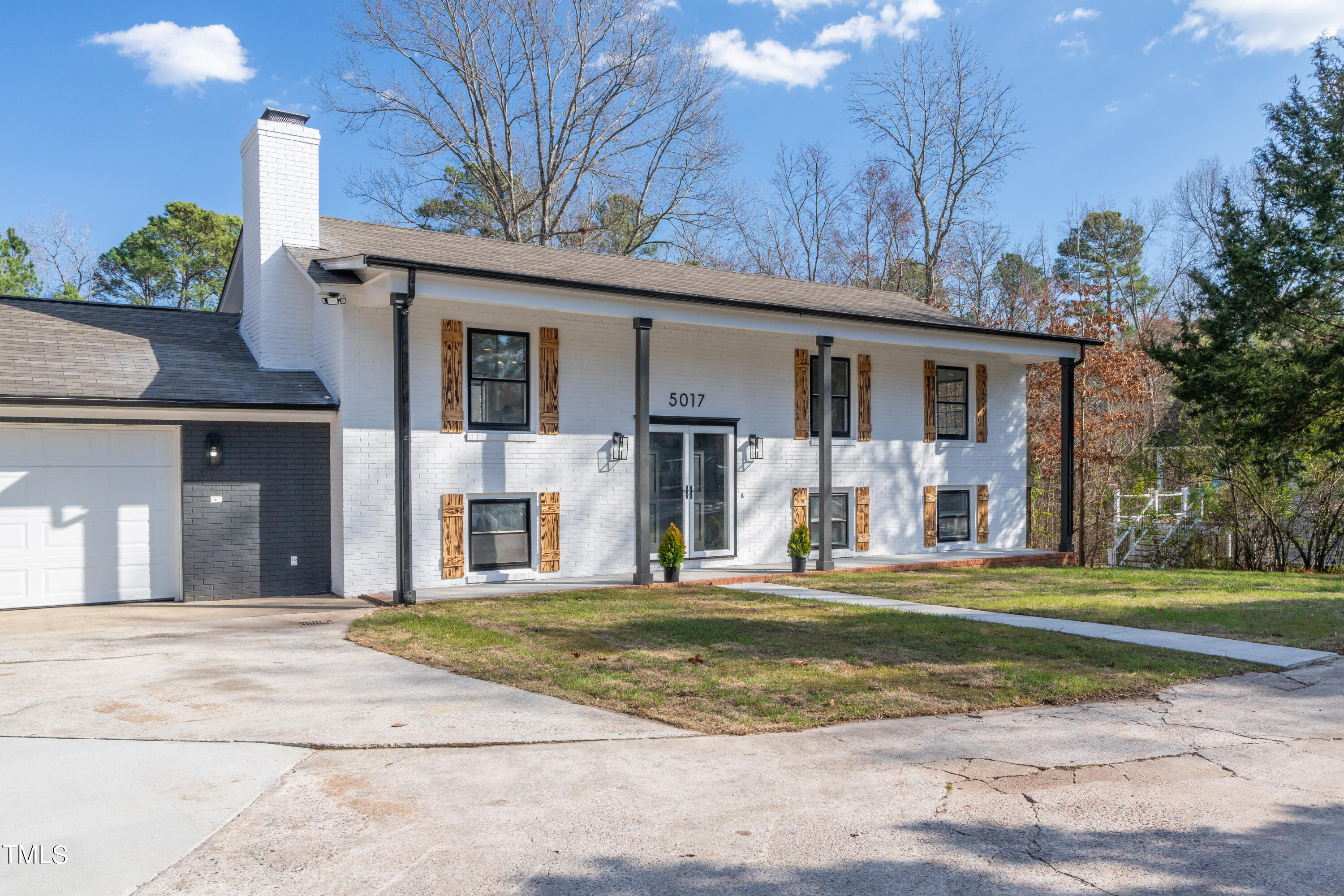 5017 Robinwood Road Durham, NC 27713 - Photo 2 of 45 a front view of a house with a yard