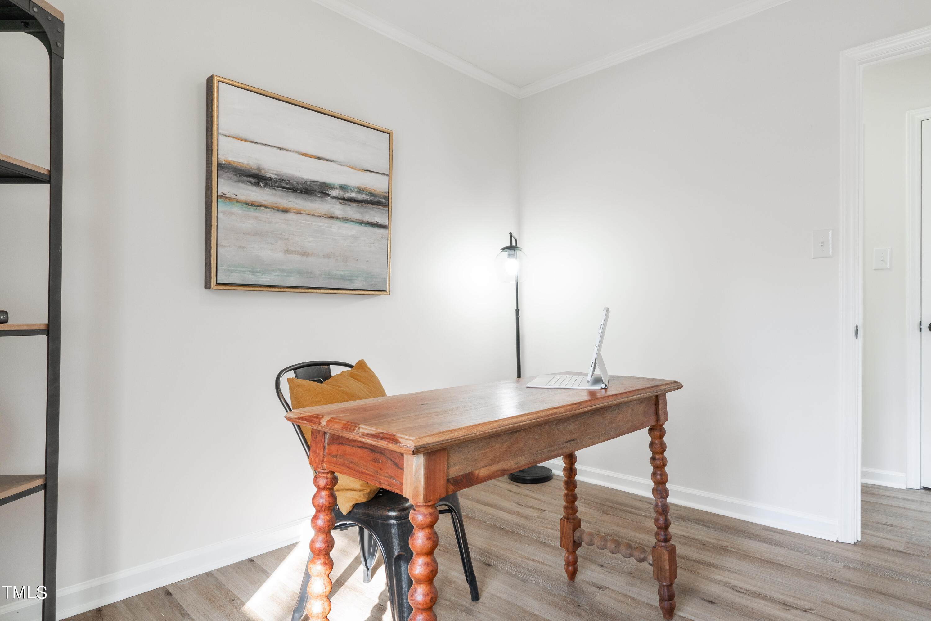 5017 Robinwood Road Durham, NC 27713 - Photo 21 of 45 a view of a workspace with furniture and wooden floor