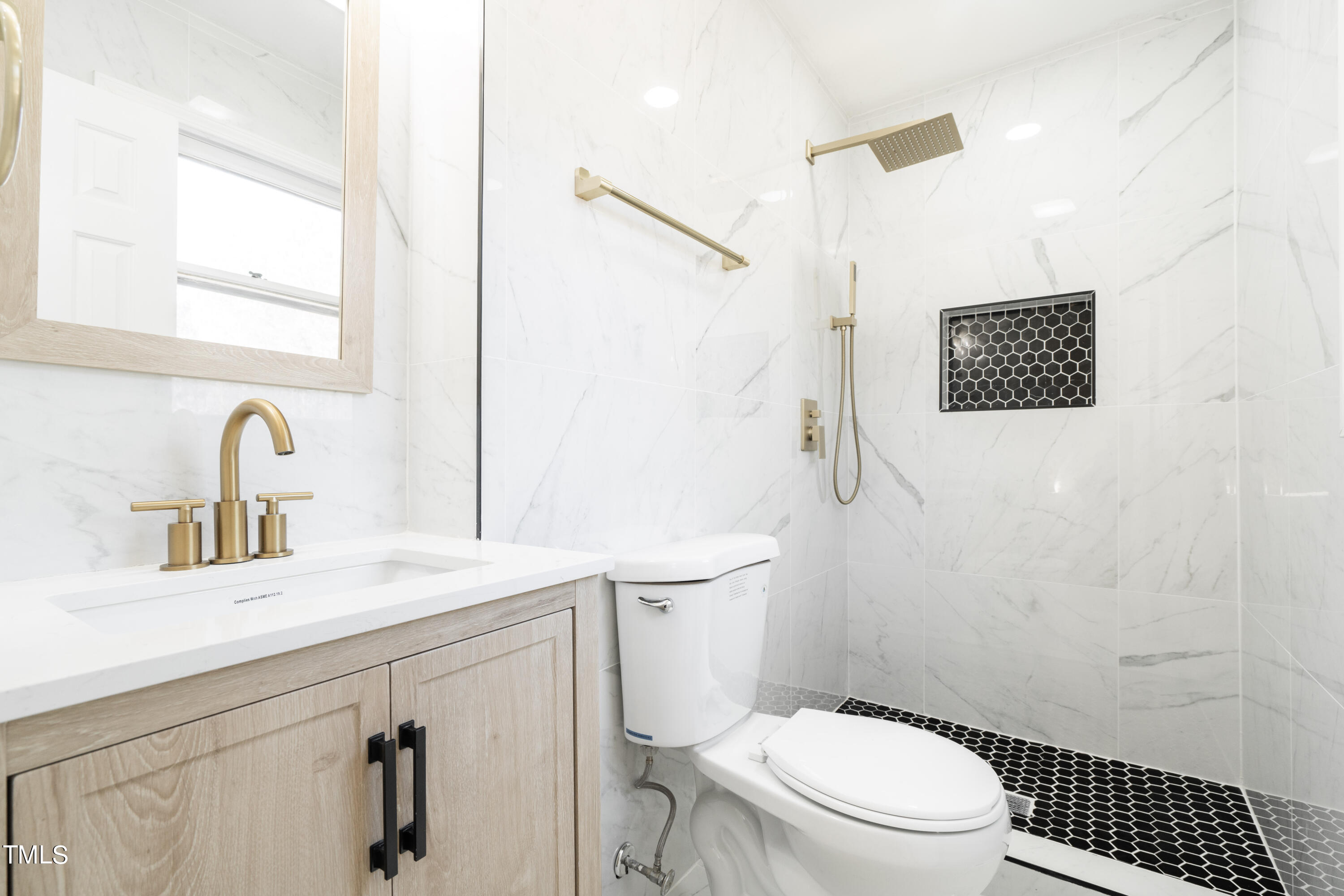 5017 Robinwood Road Durham, NC 27713 - Photo 24 of 45 a bathroom with a sink a toilet and a mirror
