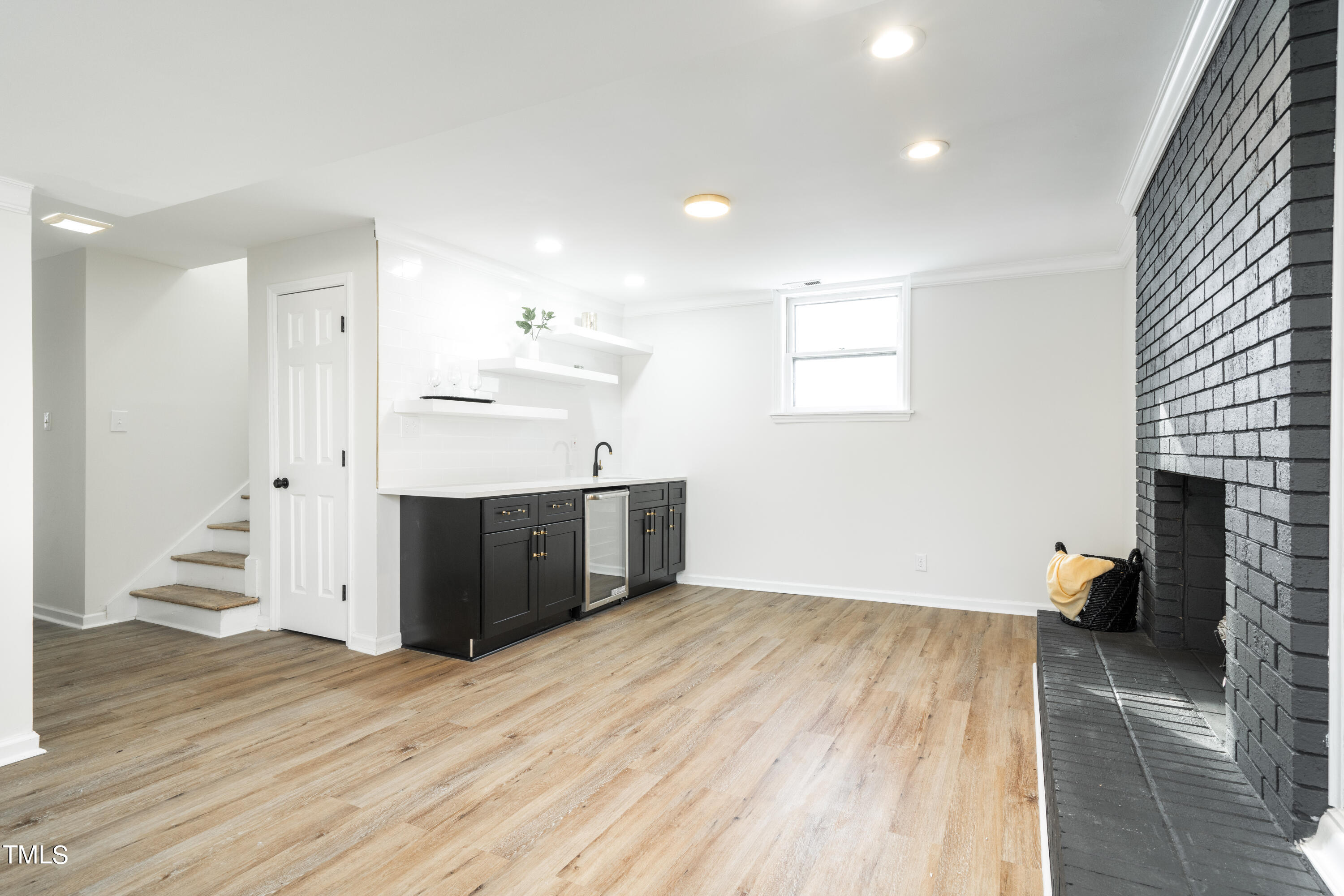 5017 Robinwood Road Durham, NC 27713 - Photo 25 of 45 a view of a kitchen with wooden floor and a refrigerator