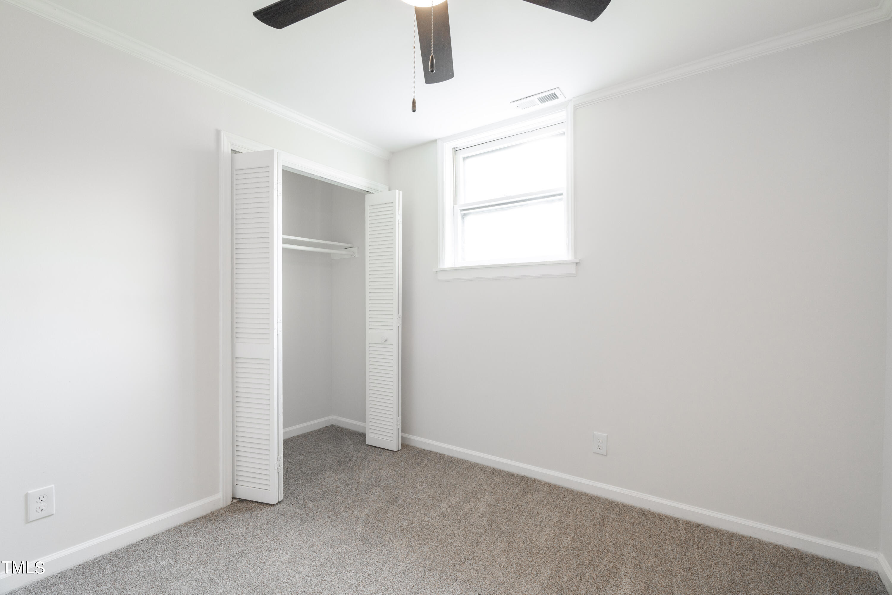 5017 Robinwood Road Durham, NC 27713 - Photo 29 of 45 an empty room with windows & cabinet