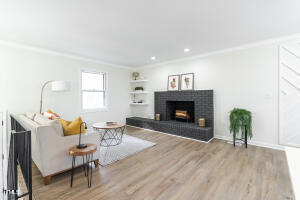 5017 Robinwood Road Durham, NC 27713 - Photo 3 of 45 a living room with furniture and a fireplace