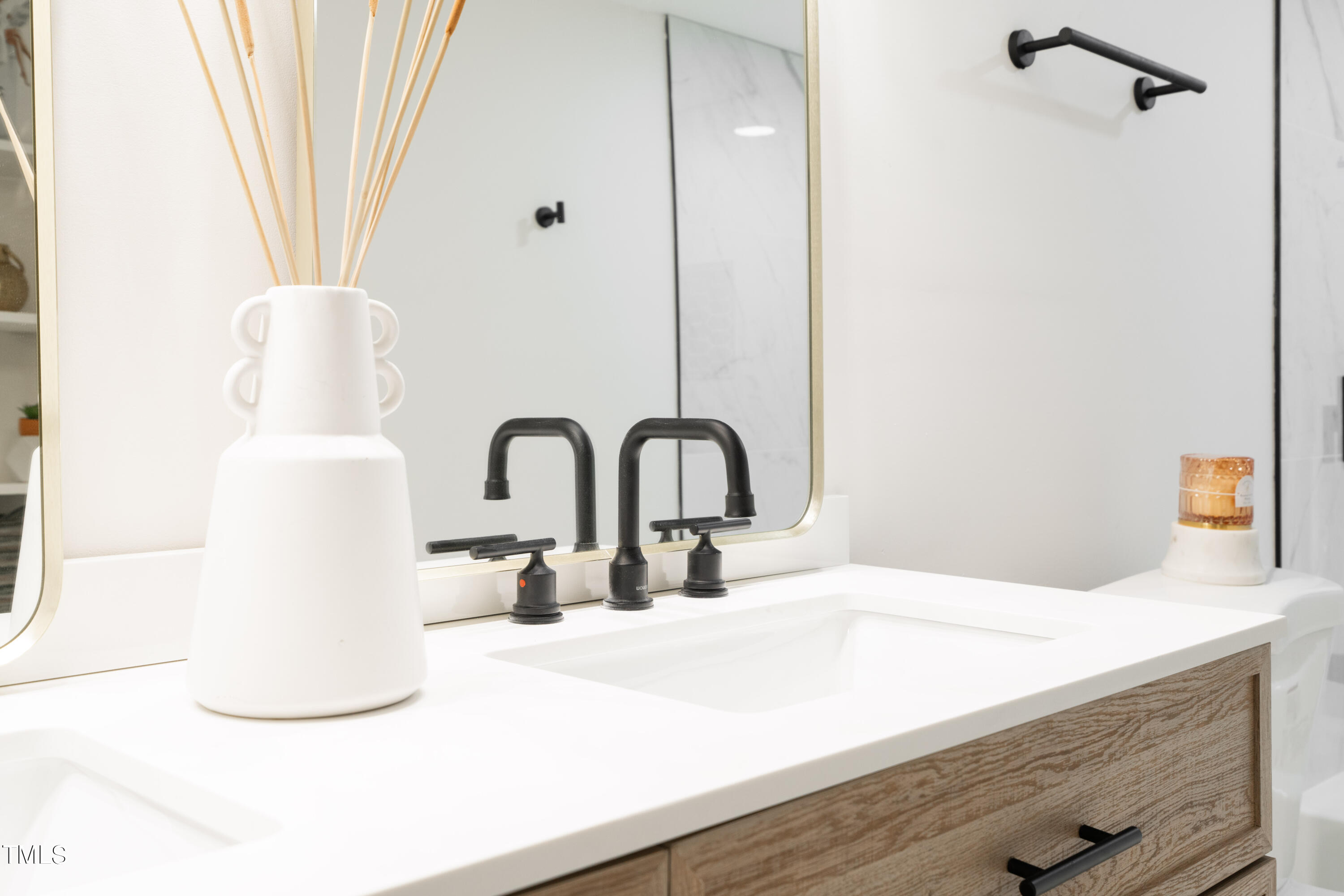 5017 Robinwood Road Durham, NC 27713 - Photo 36 of 45 a bathroom with a sink and a mirror
