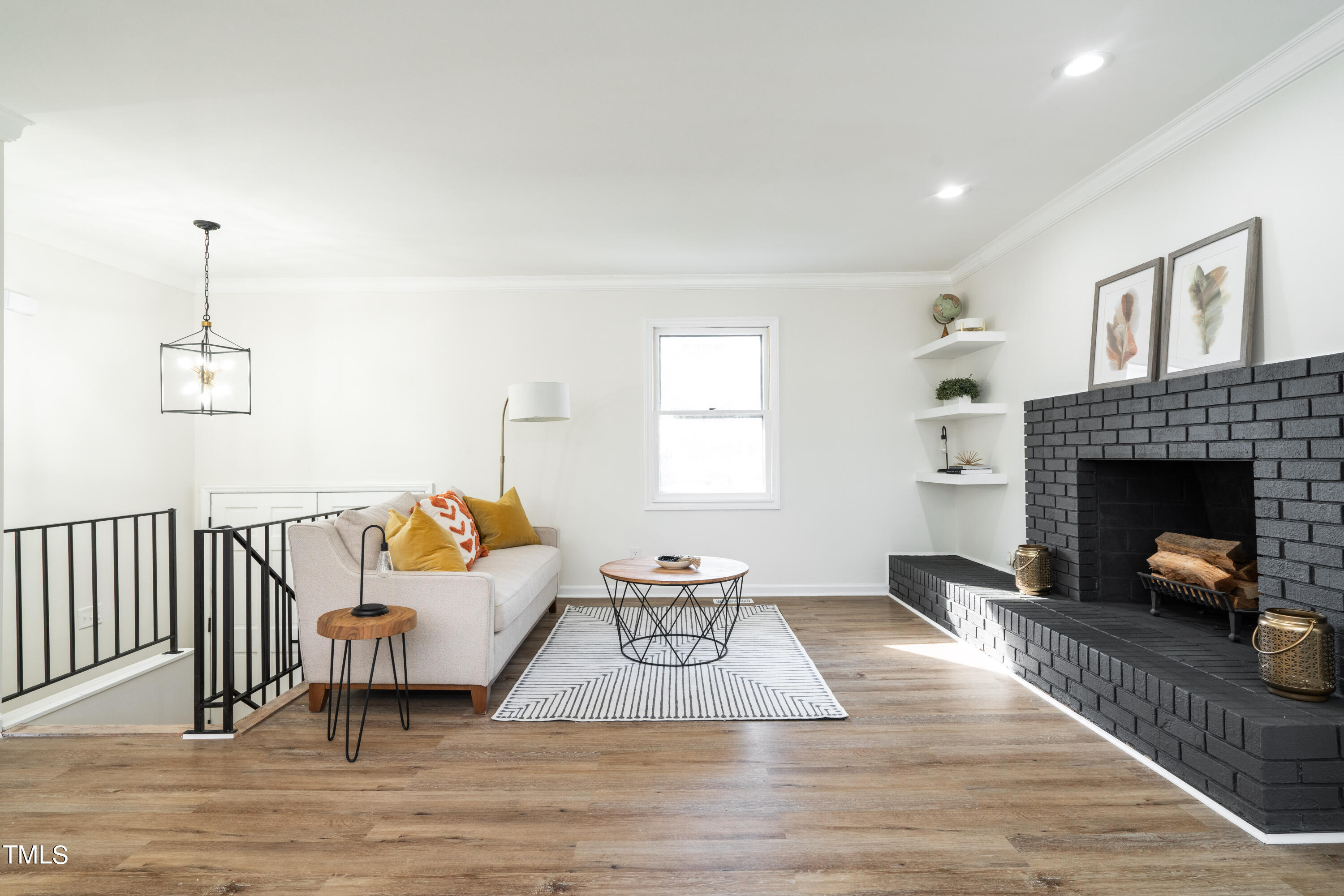 5017 Robinwood Road Durham, NC 27713 - Photo 4 of 45 a living room with furniture and a fireplace
