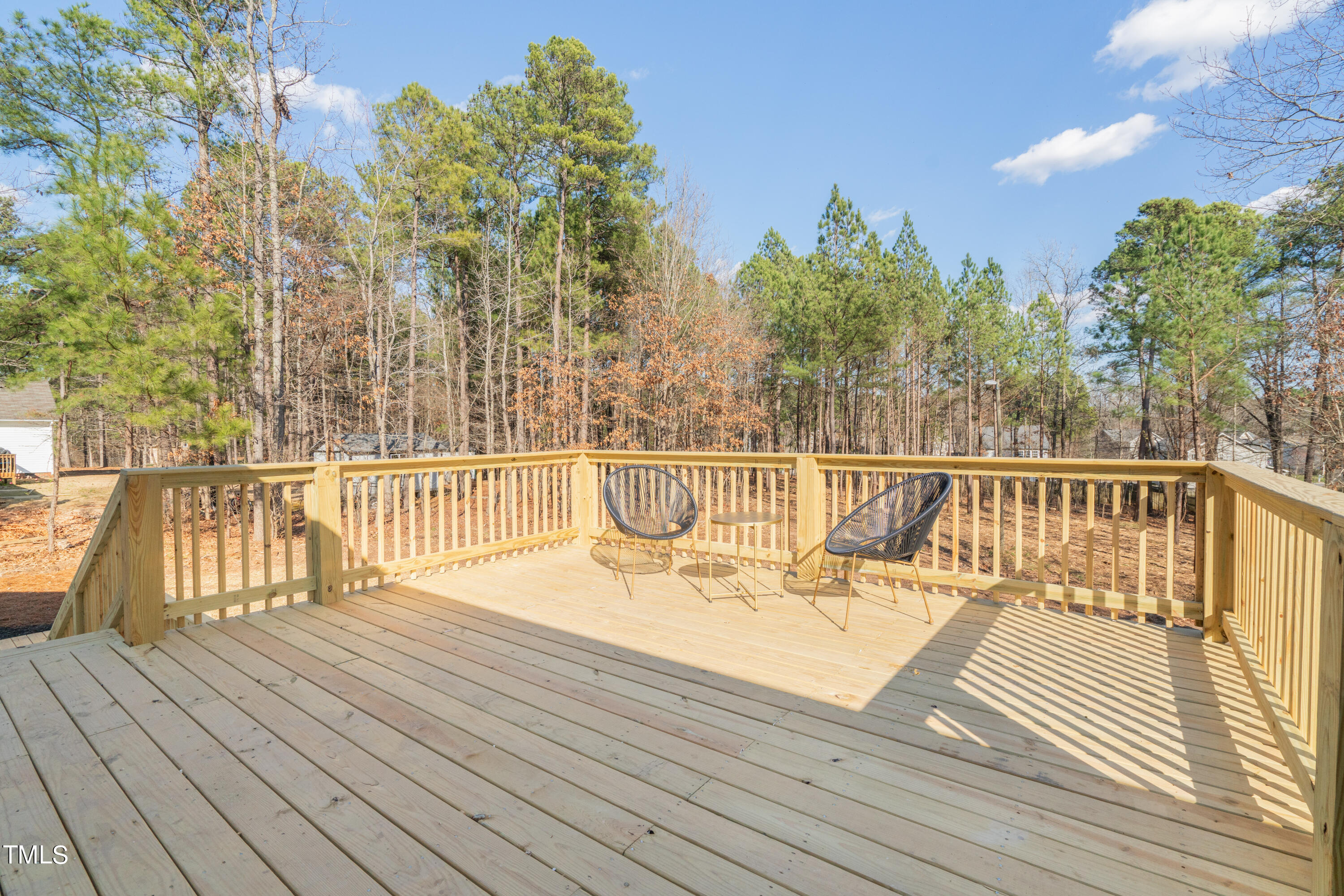 5017 Robinwood Road Durham, NC 27713 - Photo 44 of 45 a view of a balcony with wooden floor and fence