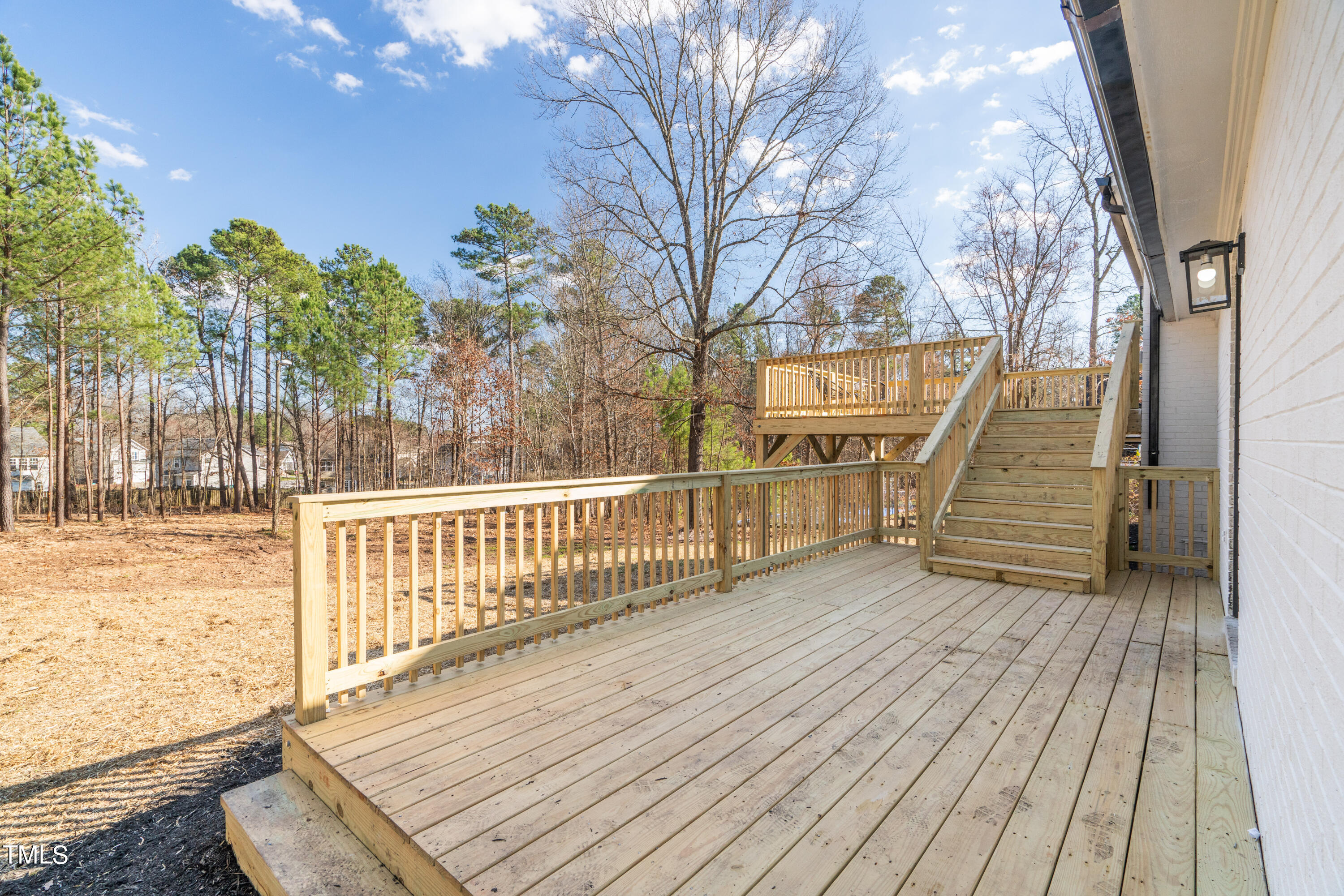 5017 Robinwood Road Durham, NC 27713 - Photo 45 of 45 a view of a wooden deck with a yard
