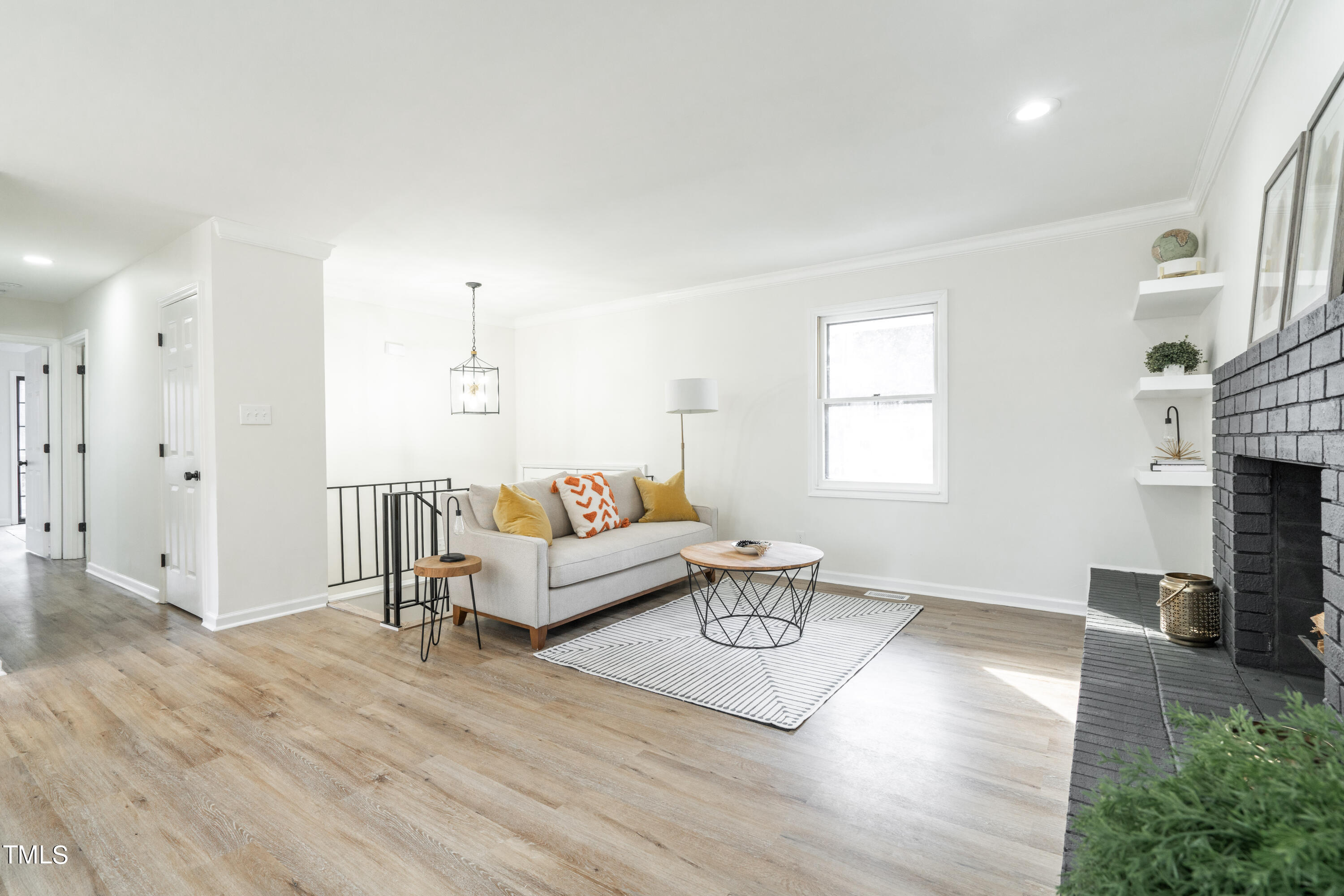 5017 Robinwood Road Durham, NC 27713 - Photo 5 of 45 a living room with furniture and a fireplace