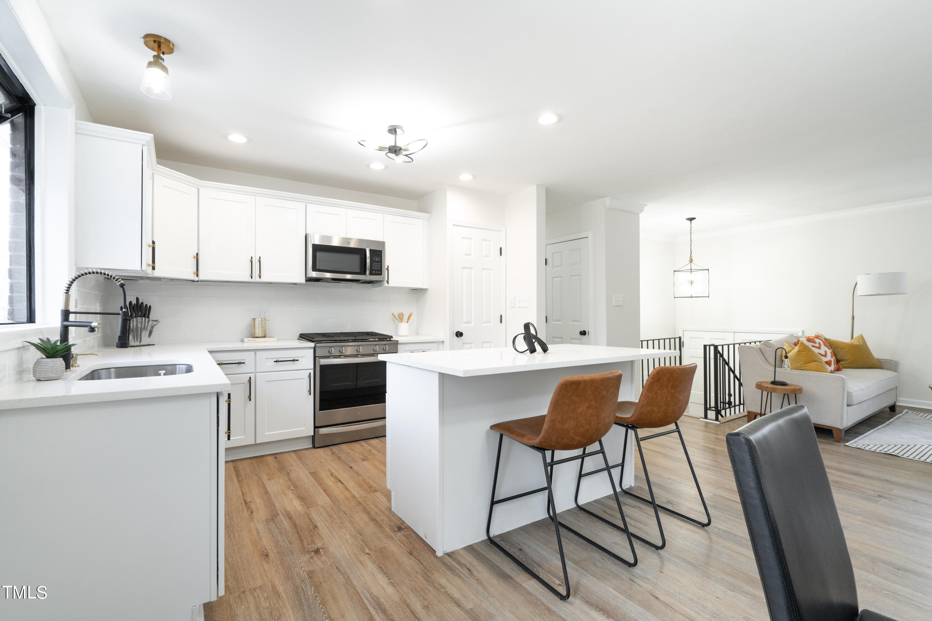 5017 Robinwood Road Durham, NC 27713 - Photo 8 of 45 a kitchen with a sink cabinets and window