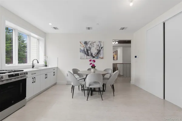 a dining room with furniture and window