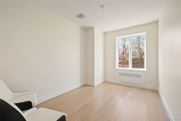 a bathroom with a toilet a sink and a window