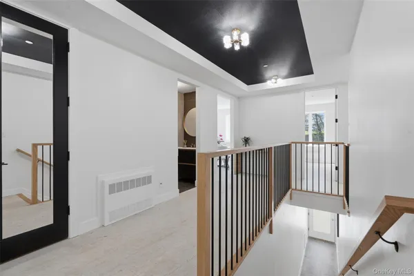 a view of a hallway with entryway and closet