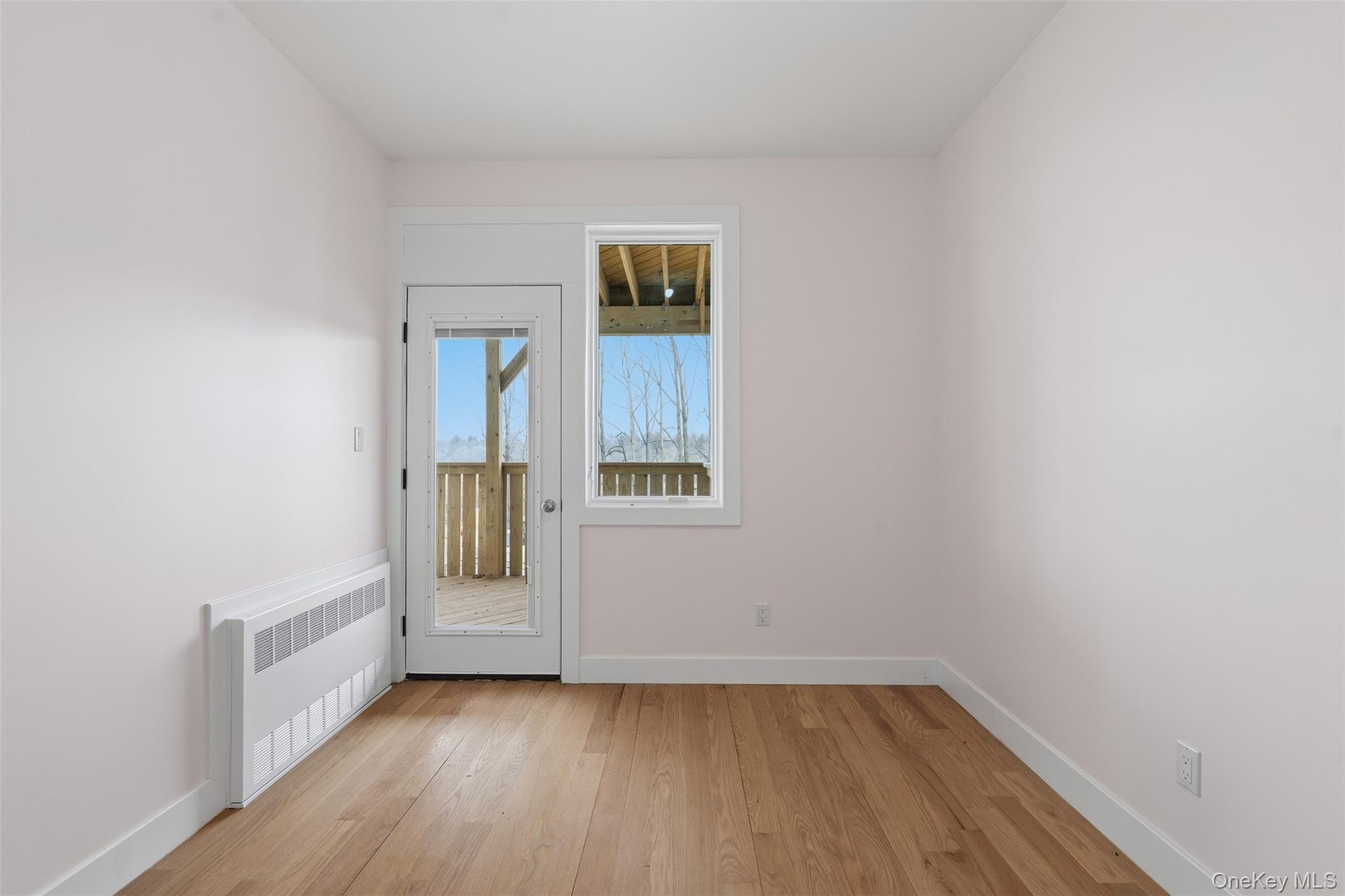 7 Valley Way, Unit 220 Spring Valley, NY 10977 - Photo 34 of 50 a view of an empty room with wooden floor and a window