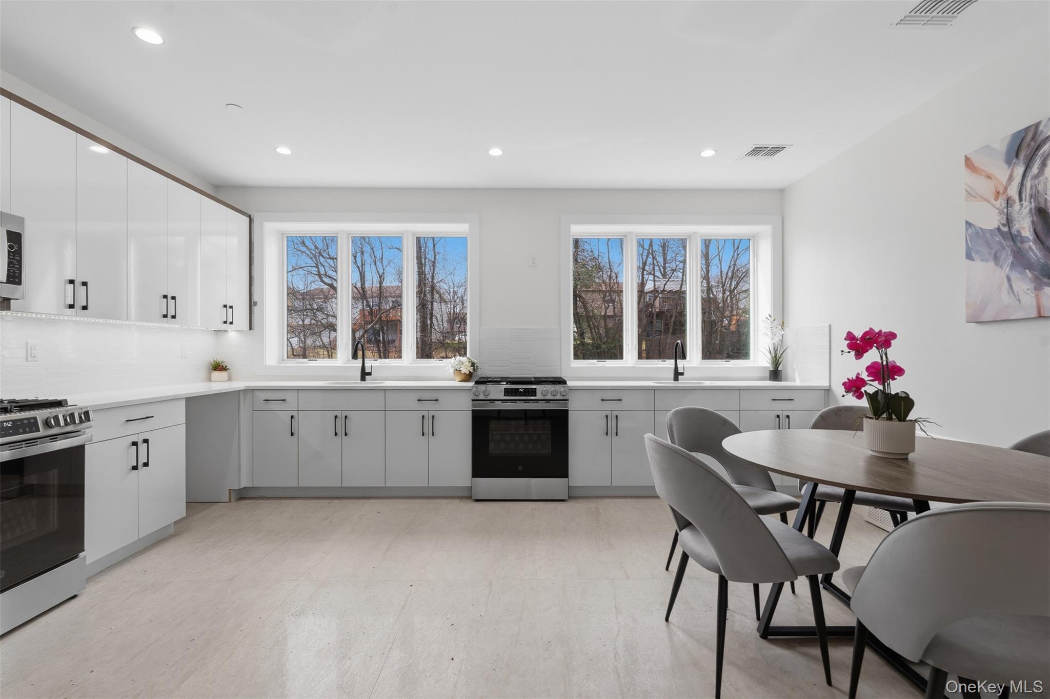 7 Valley Way, Unit 220 Spring Valley, NY 10977 - Photo 9 of 50 a kitchen with granite countertop white cabinets and stainless steel appliances