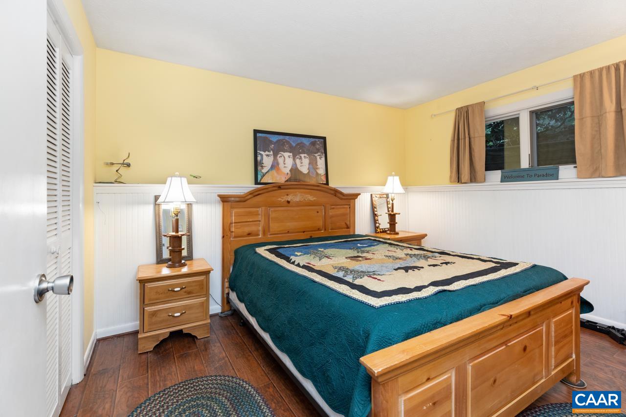 482 3 Ridges Roseland, VA 22967 - Photo 13 of 15 a bedroom with a bed and wooden floor