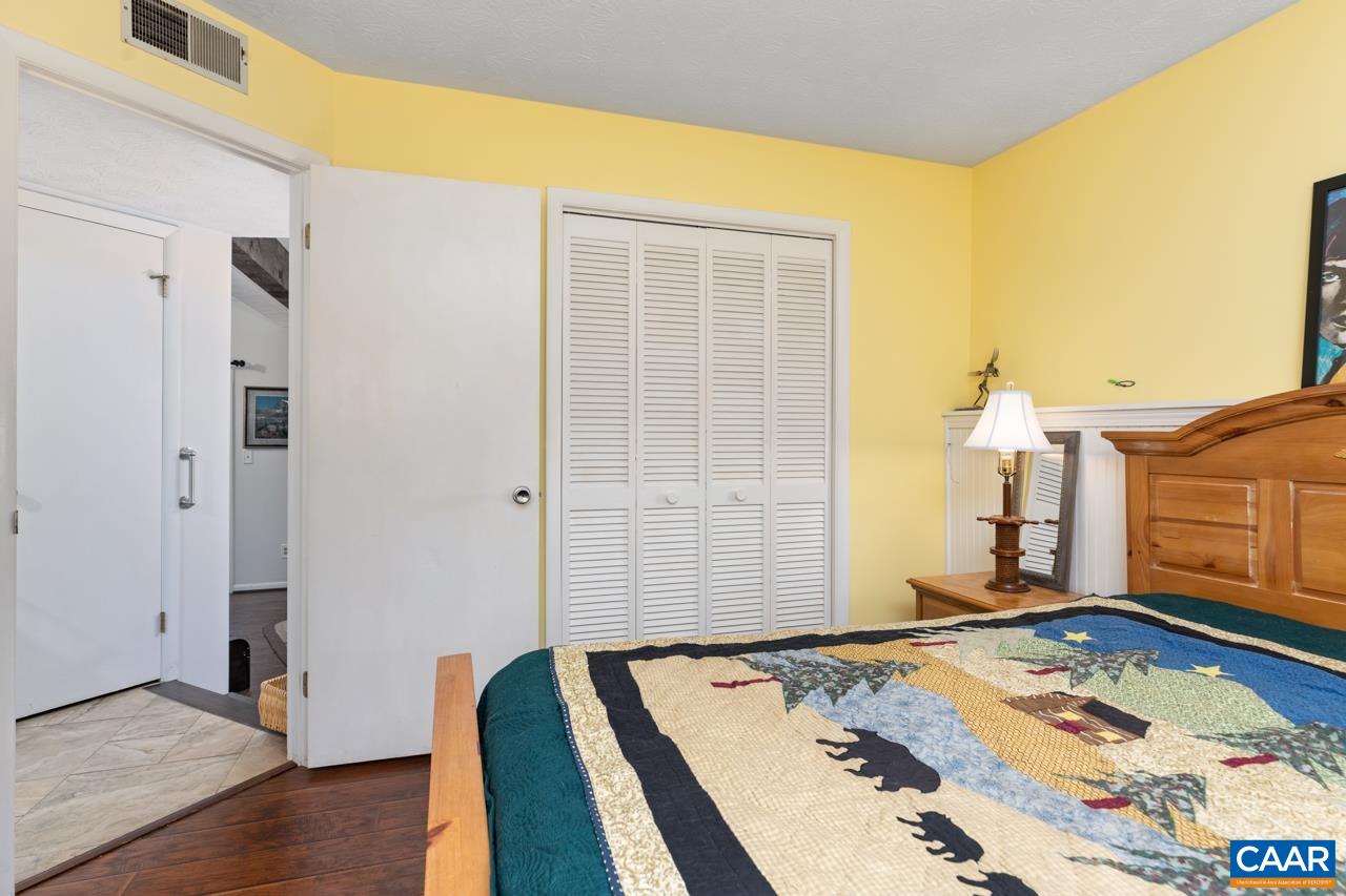 482 3 Ridges Roseland, VA 22967 - Photo 14 of 15 a bedroom with a bed and wooden floor