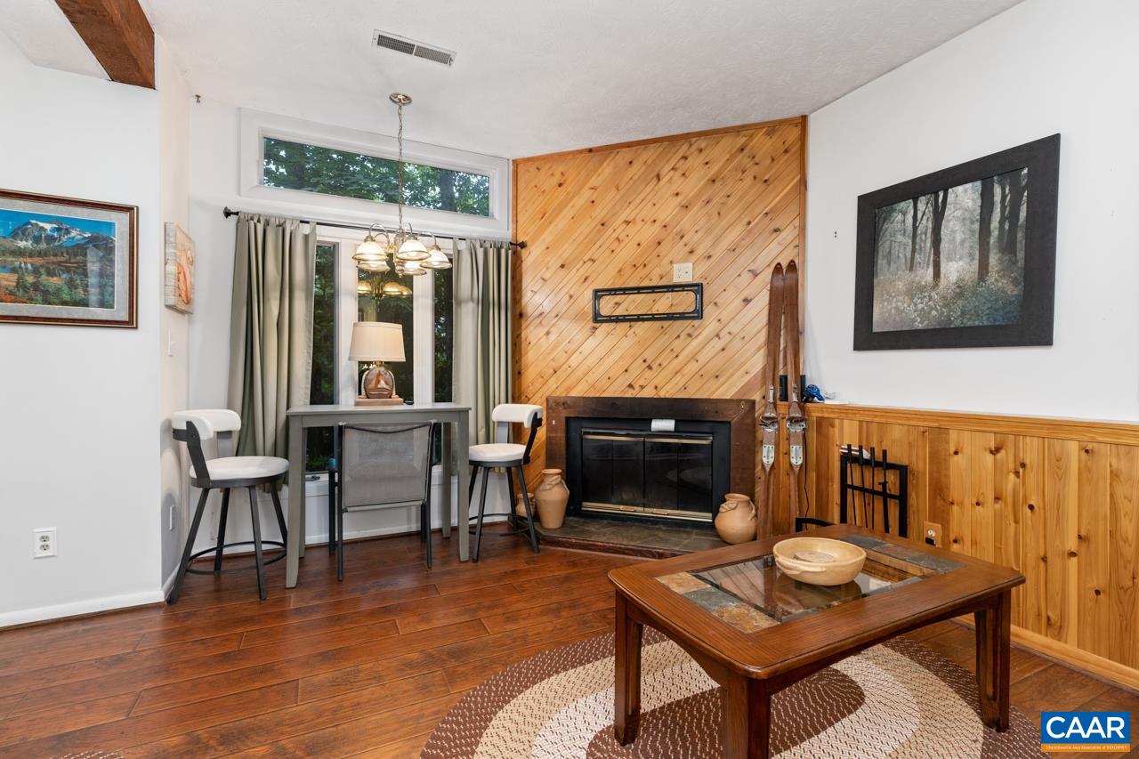 482 3 Ridges Roseland, VA 22967 - Photo 5 of 15 a living room with furniture a table and a fireplace